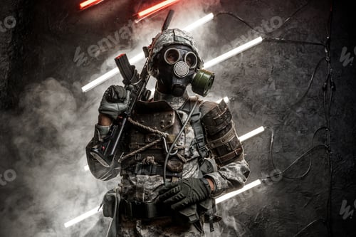 Preview: Military man with gas mask holding rifle on his shoulder