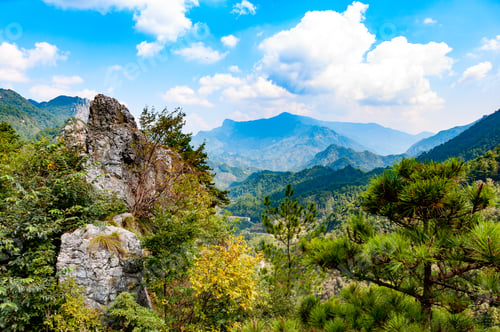 Preview: Autumn mountain scenery under blue sky and white clouds. Anhui province, East China