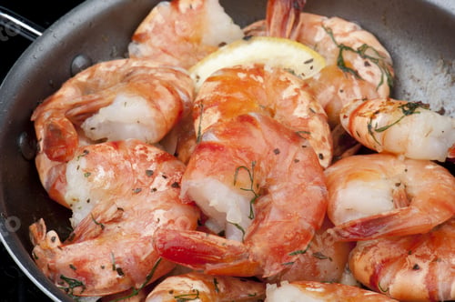 Preview: Cooking shrimp on a pan. Close up view.