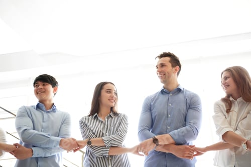 Preview: People holding hands indoors. Unity concept