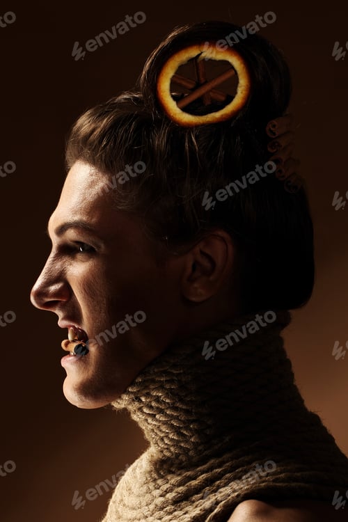 Preview: Creative image with orange and cinnamon in a hairstyle