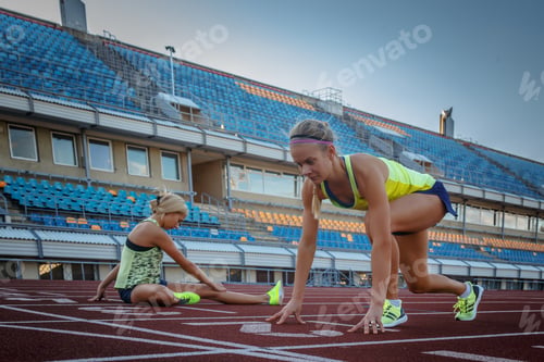 Preview: Two female sprinter athlete in the athletics stadium.