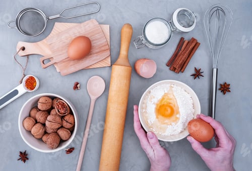 Preview: Top view of pastry chef's workplace makes dough for pie