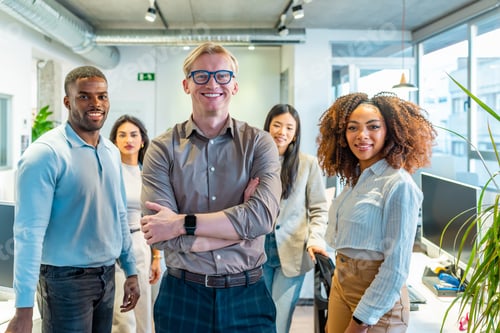 Preview: Startup team smiling in coworking office, multi ethnic professionals collaborating
