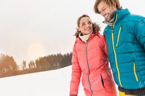 Preview: Couple walking in snow