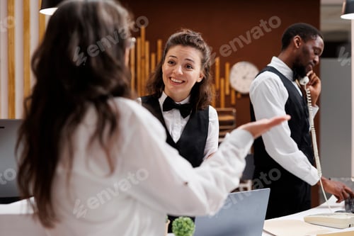 Preview: Concierge assists with check-in at hotel