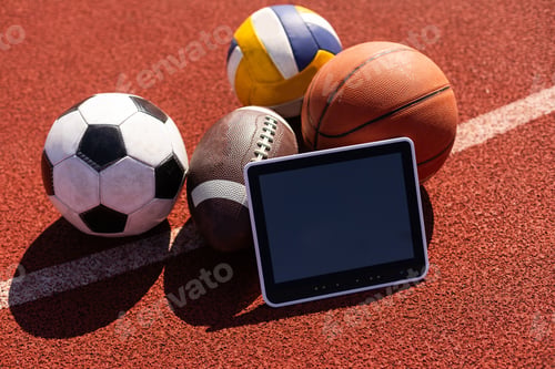 Preview: Tablet computer and balls. Concept of sports bet