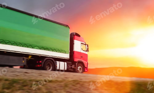 Preview: Truck Transporting Goods at Sunrise on a Highway