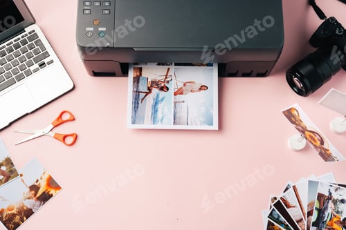 Preview: Printer, laptop and camera on table close up. Printing photos