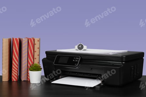 Preview: Home laser printer on desk against purple background