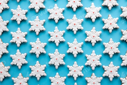 Preview: Gingerbread in the form of snowflakes on a blue background.