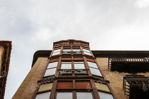 Preview: Low angle shot of a residential building on a cloudy sky background