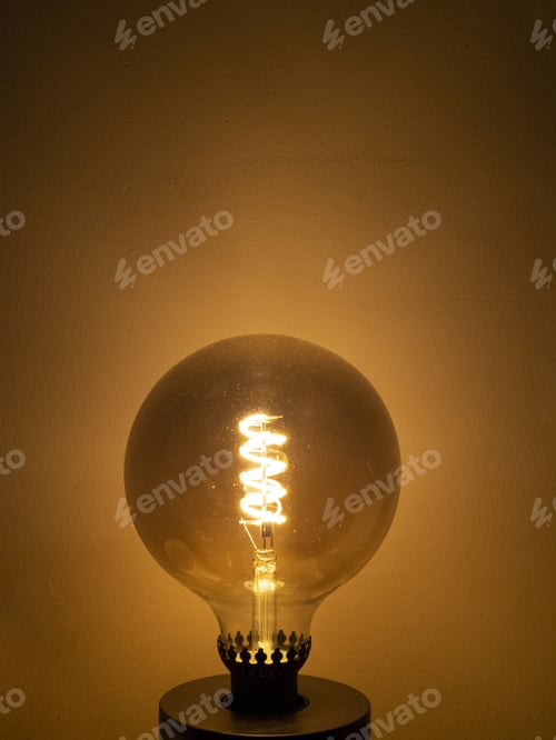 Preview: Vertical shot of a big round electric bulb