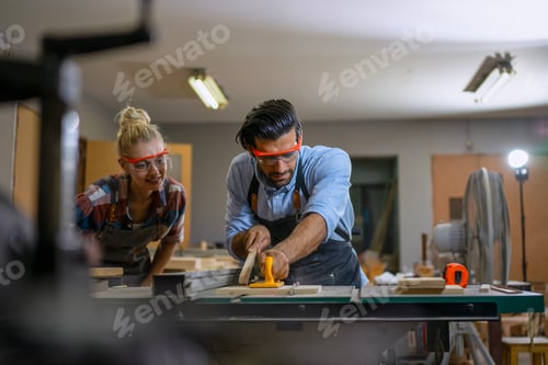 Preview: Carpenters are working together at workshop.