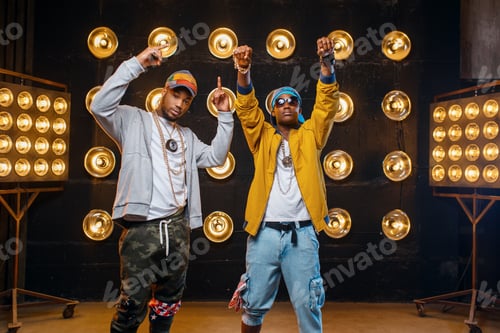Preview: Two black rappers in caps, perfomance on stage