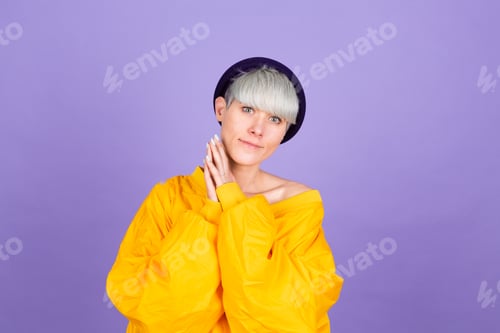 Preview: Stylish european woman on purple background happy sweet smile hands together