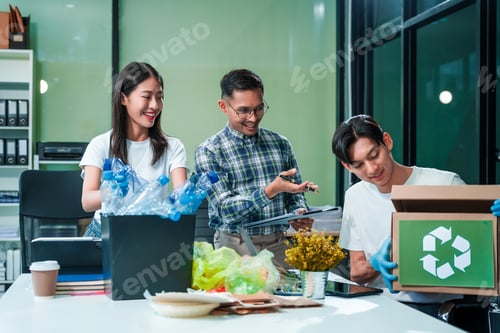 Preview: Asian team discusses waste management strategies at desk, separating plastic waste.