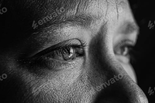 Preview: Gray-scale closeup of the eyes of a woman with tears in her eyes