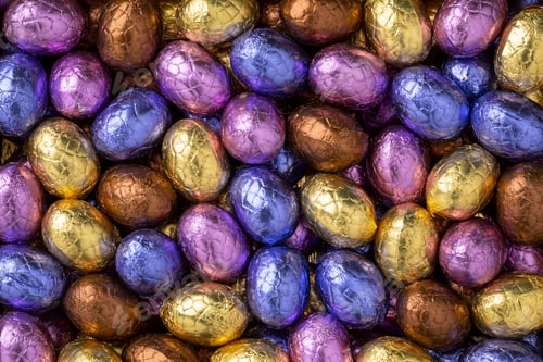 Preview: Chocolate easter eggs in colorful tinfoil close up
