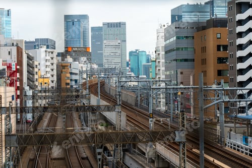Preview: rain on the JR Yokosuka-Sobu Line passing through Nippori Station in Tokyo, Japan
