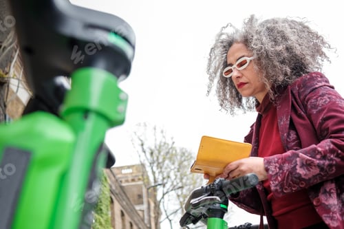 Preview: Iranian mature woman renting an electric scooter in London.