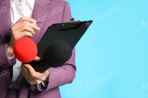 Preview: Professional journalist taking notes on light blue background, closeup. Space for text