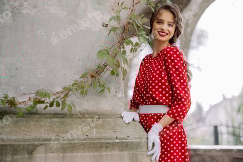 Preview: Beautiful Woman Posing in Red Polka Dot Dress