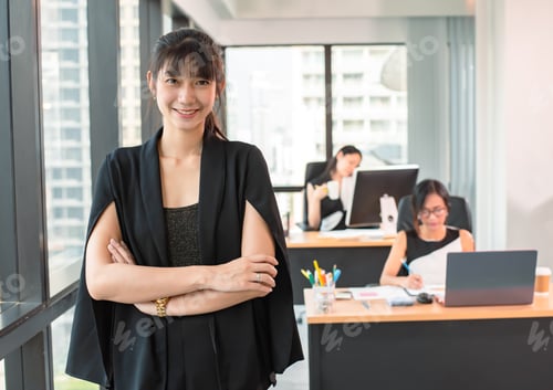 Preview: confident asian young businesswoman standing in modern office