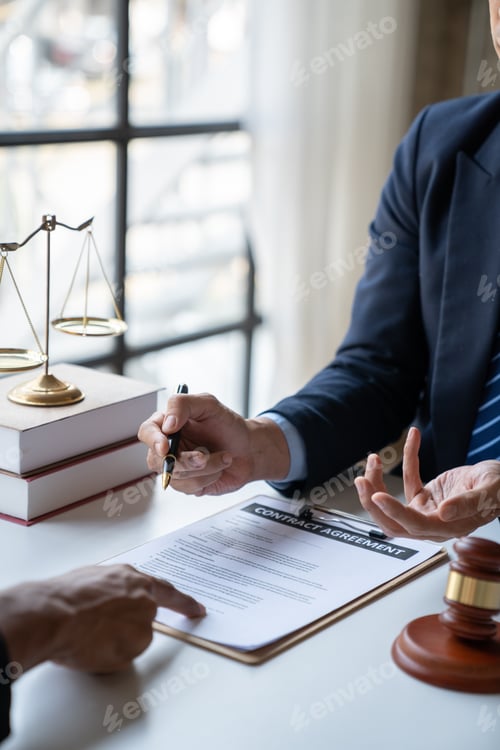 Preview: Law concept. Asian young lawyer or legal advisor explaining details Business contract agreement befo