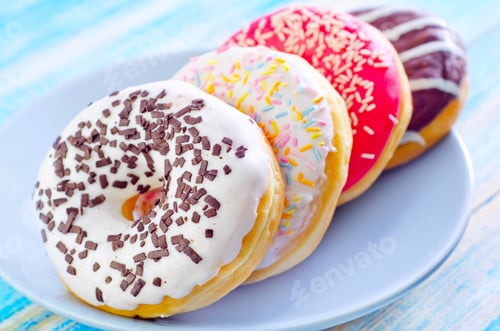 Colorful Donuts with Various Frostings on Plate