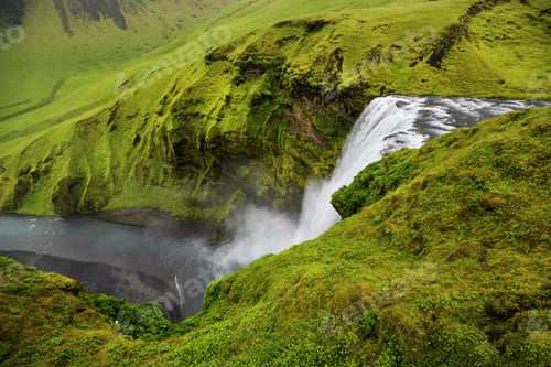 Preview: A waterfall in a beautiful Iceland landscape. Top view.
