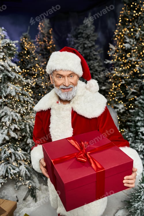 Preview: Santa Claus joyfully presents a beautifully wrapped gift in a winter wonderland setting