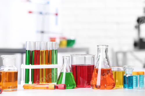 Preview: Different glassware with samples on table in chemistry laboratory