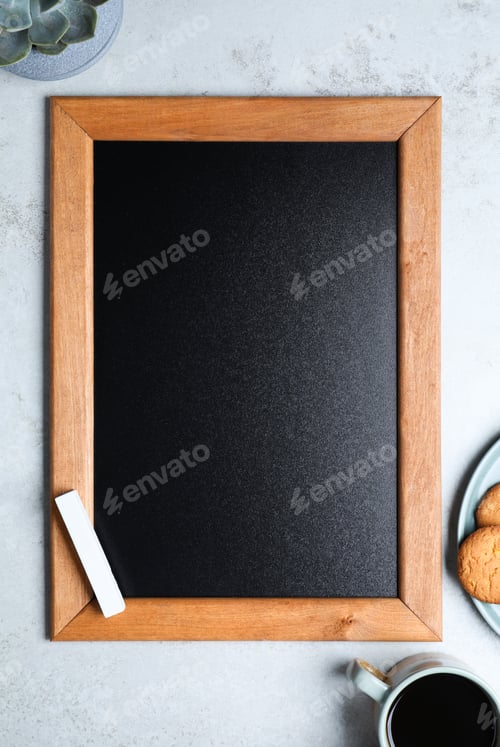 Preview: Clean small chalkboard, coffee and cookies on light grey table, flat lay