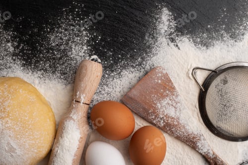Preview: Baking utensils and dough laying on flour flat lay view with copyspace