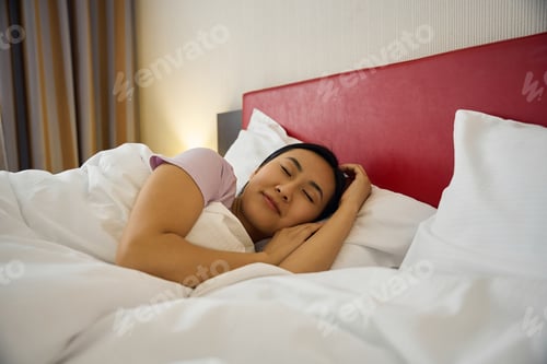 Preview: Serene young Asian lady sleeping in bedroom