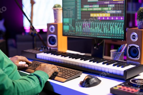 Preview: Sound designer operating on a professional editing software on pc