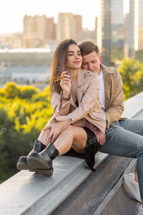 Preview: Beautiful happy young loving couple on a surprise date on a Saint Valentine's Day on a rooftop