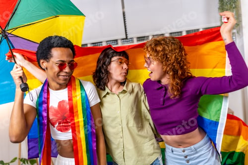 Preview: Non binary and transgender people dancing waving rainbow lgbt flag