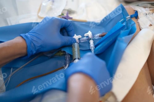 Preview: Doctor injecting medicine into iv catheter of patient in hospital