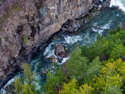 Preview: Rugged Canyon and River Gorge Surrounded by Evergreen Forests and Towering Cliffs in BC, Canada