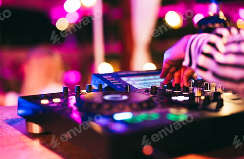 Preview: Dj playing music during winter holiday party inside cocktail bar