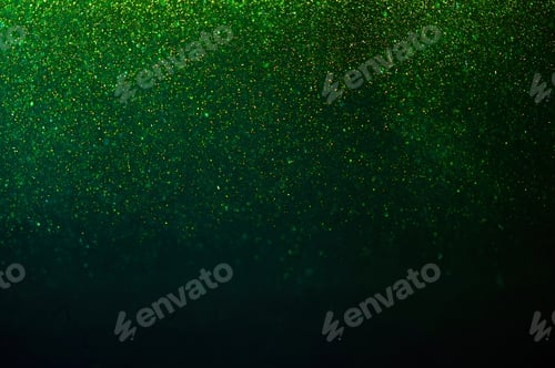 Visualização: Partículas de poeira mágicas cintilantes. Brilhos caindo sobre fundo verde
.