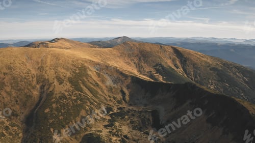 Preview: Drone flying over mountain peaks, ridges. Pine forest at green grass peaks. Nobody nature landscape
