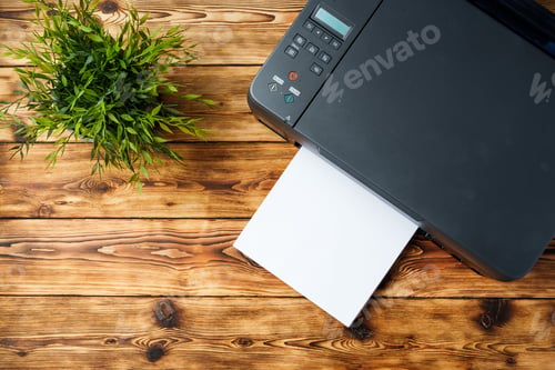 Preview: Modern laser printer with paper on wooden background