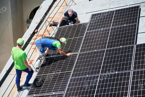 Preview: Workers building solar panel system on roof of house. Men installing photovoltaic solar module