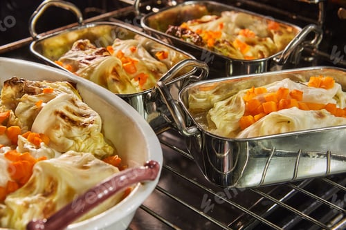 Preview: Cabbage rolls with salmon, carrots and sauce are baked in the oven. French recipe