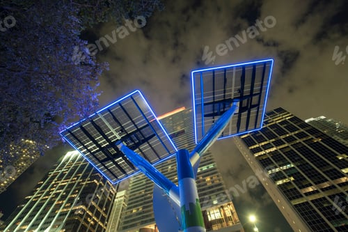 Preview: Downtown district of Miami city with photovoltaic panels mounted on metal poles