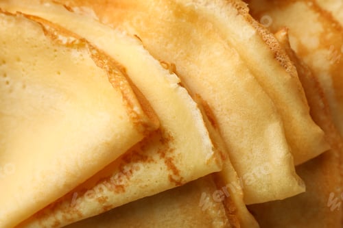 Preview: Delicious thin pancakes on whole background, close up