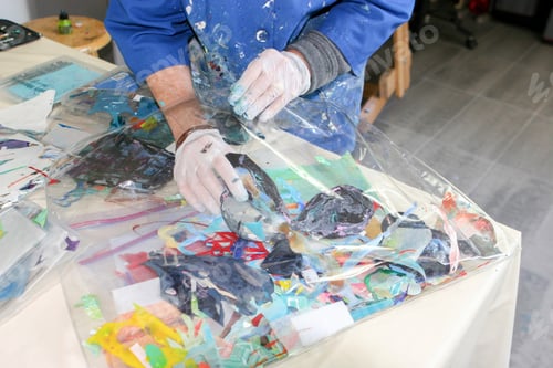 Preview: Cropped view of artist creating artwork